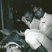 Dr Wochos, Surgeon, Rotation I, with unknown nurse, and  counterpart.